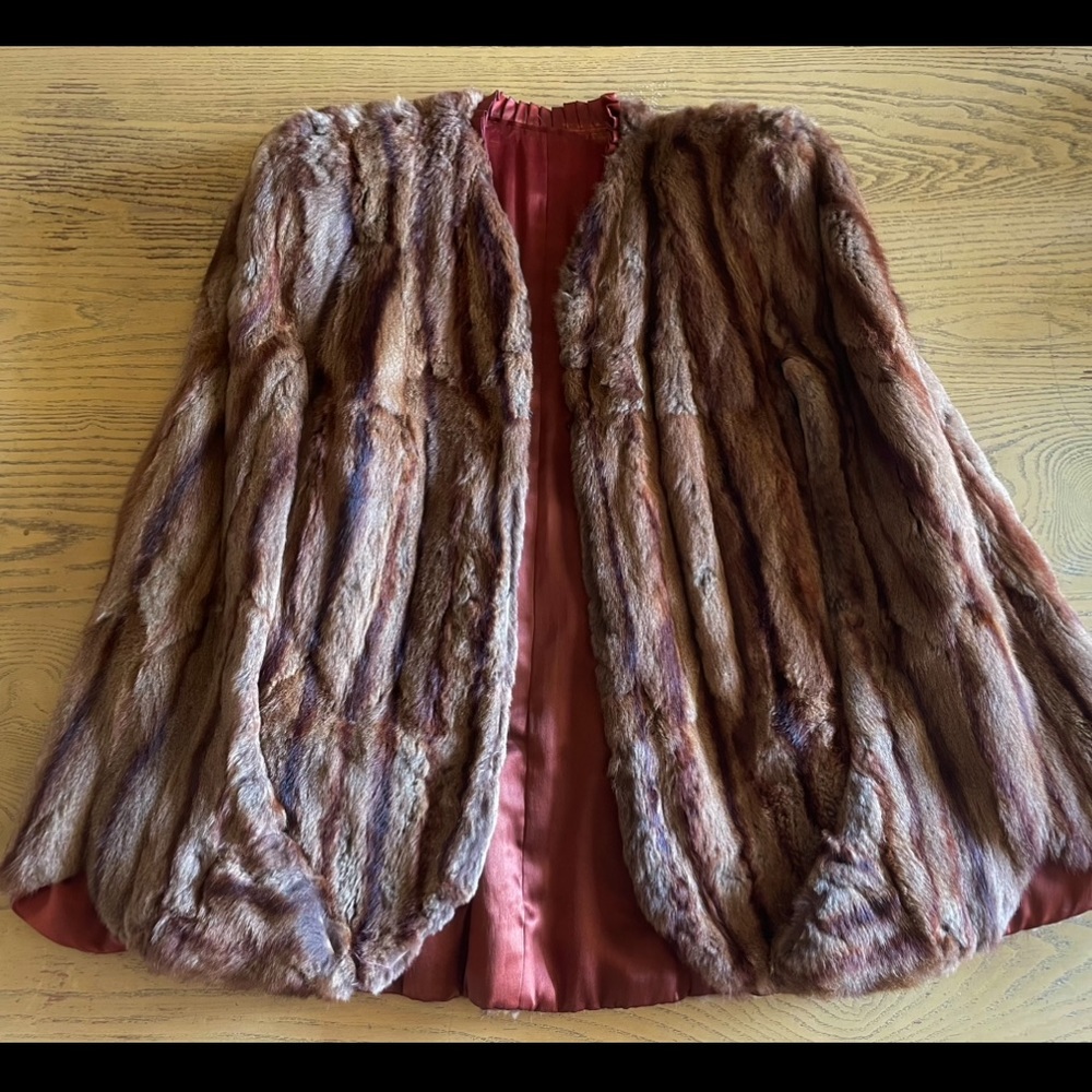 Stunning vintage circa 1940’s soft natural fur cape. Shoulder pads & arm slits